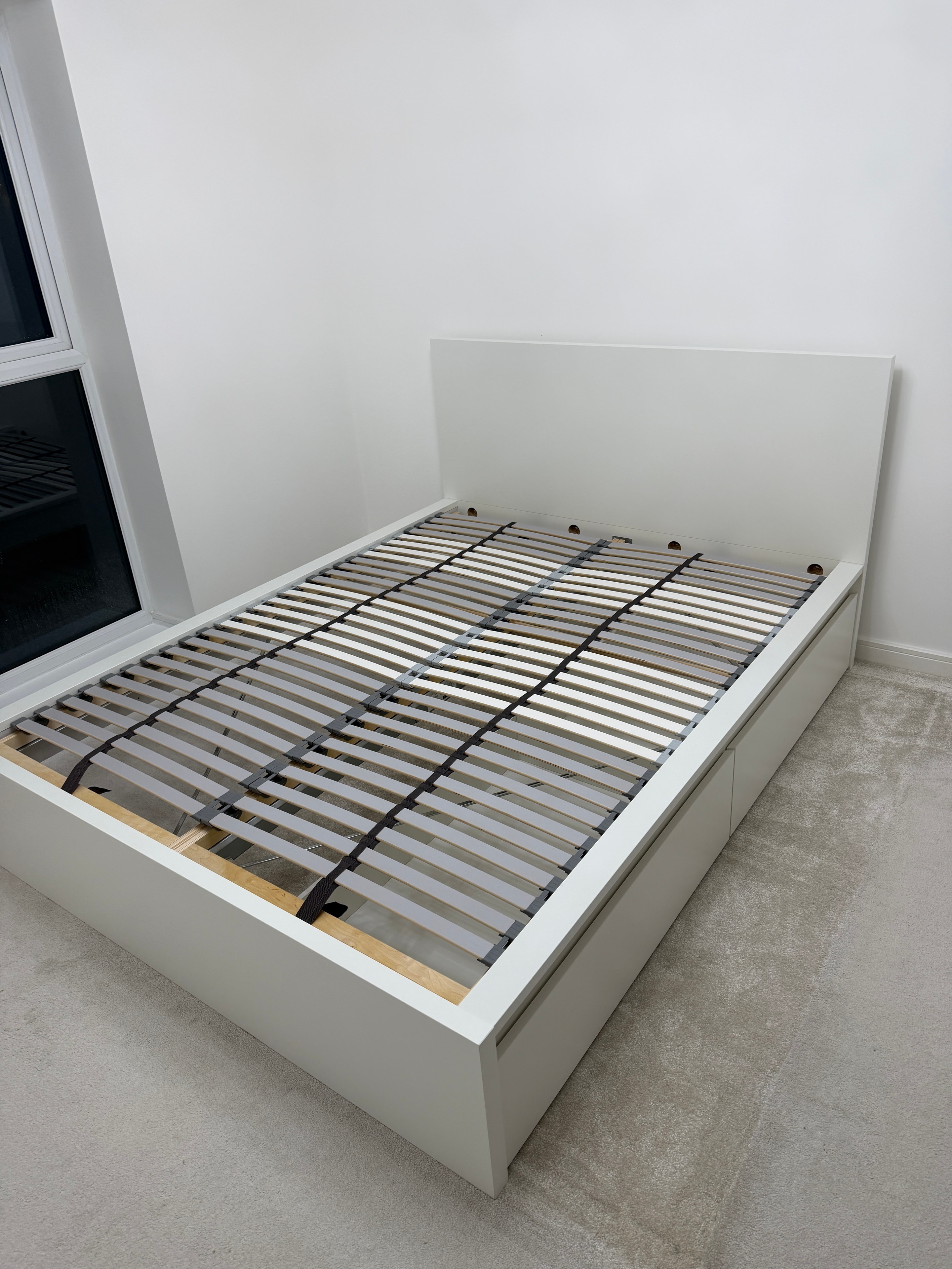 White bed frame with slatted base assembled