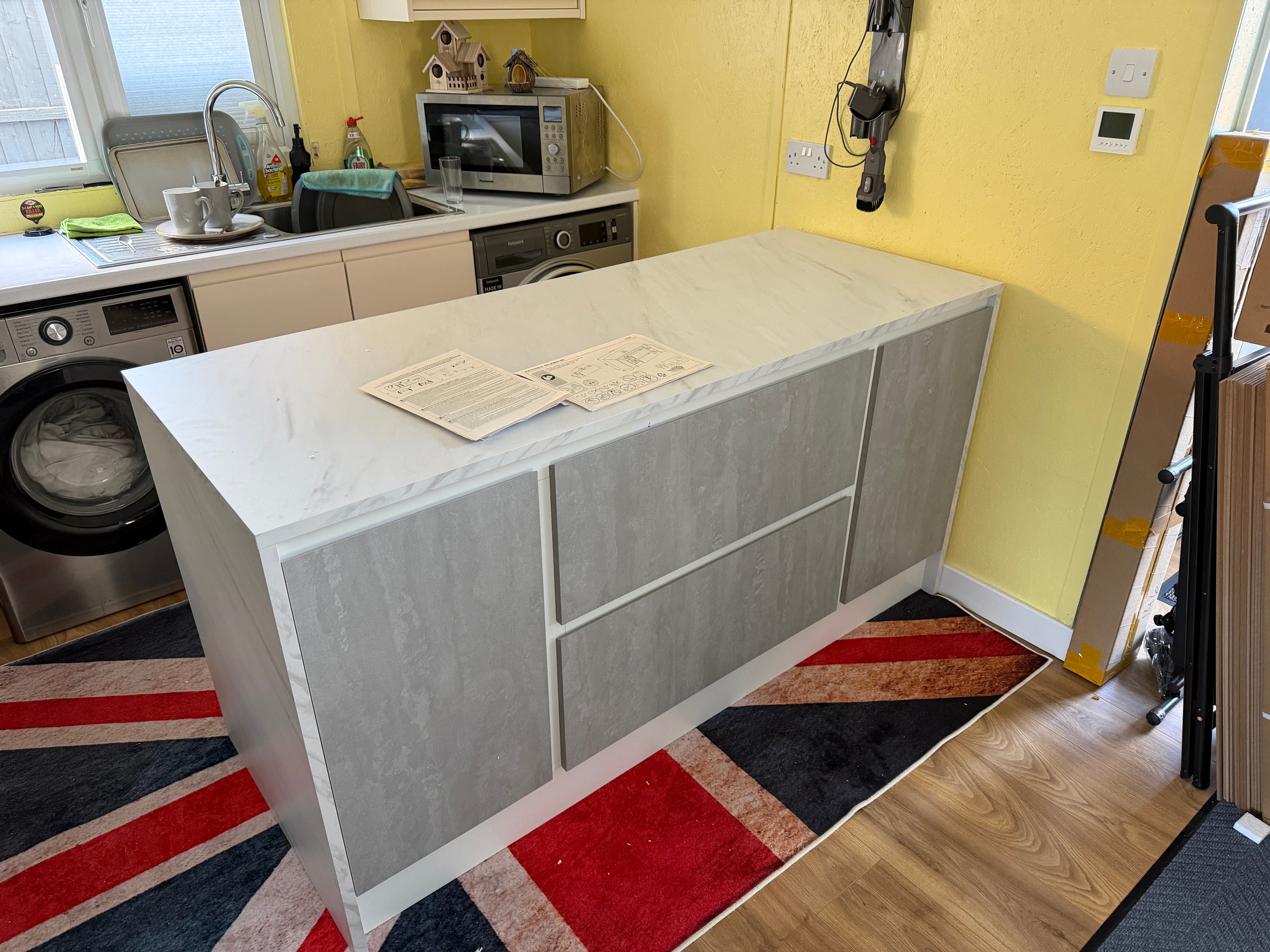 Large sideboard with marble-effect top assembled in living room